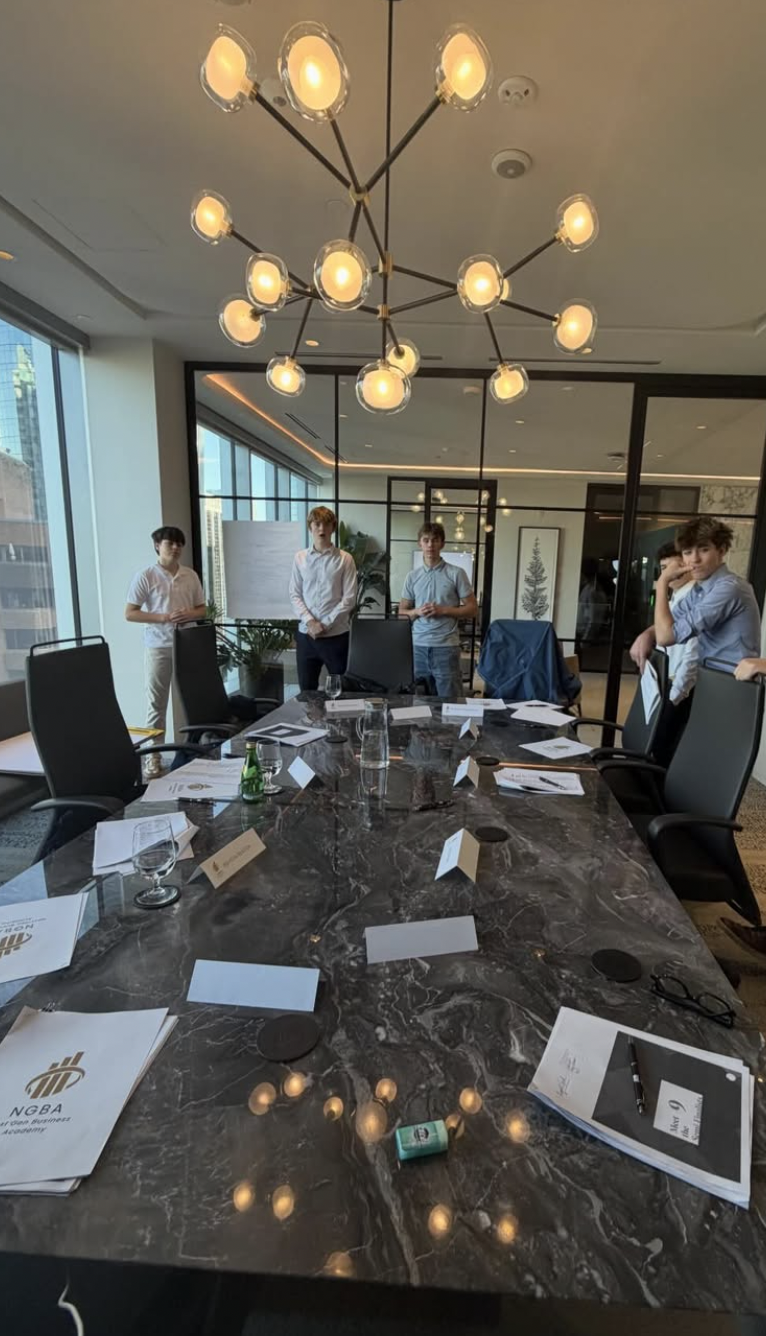 Members standing around the table during a session breakdown